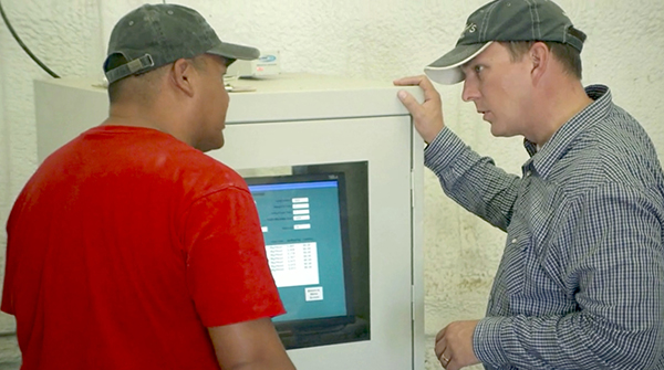 cattle producers using a feed batching system